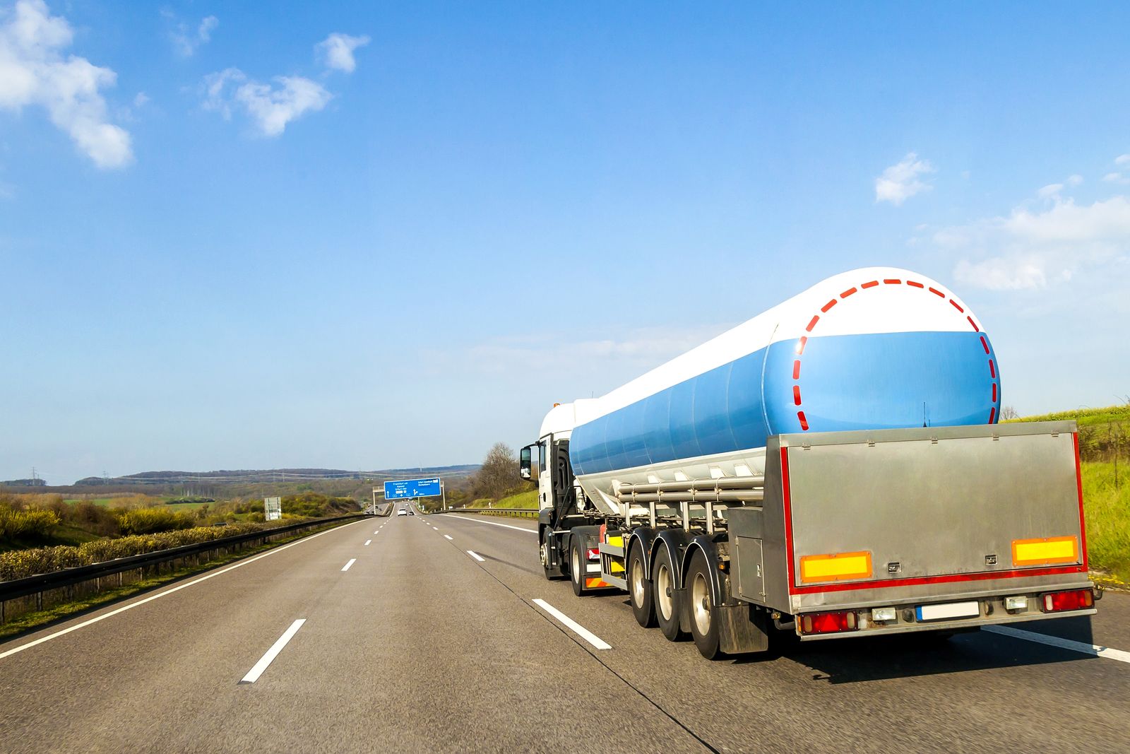 Fuel tanker truck driving on a multi-lane highway