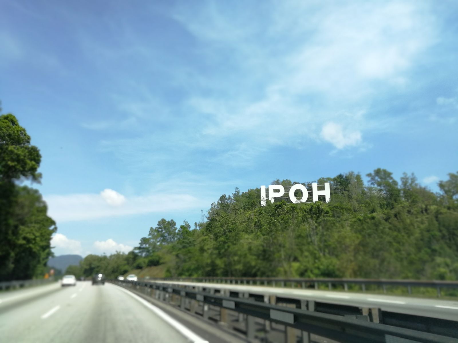 IPOH letters on a hillside beside a divided road, home ground for Ipoh JPJ speed limiter fleets