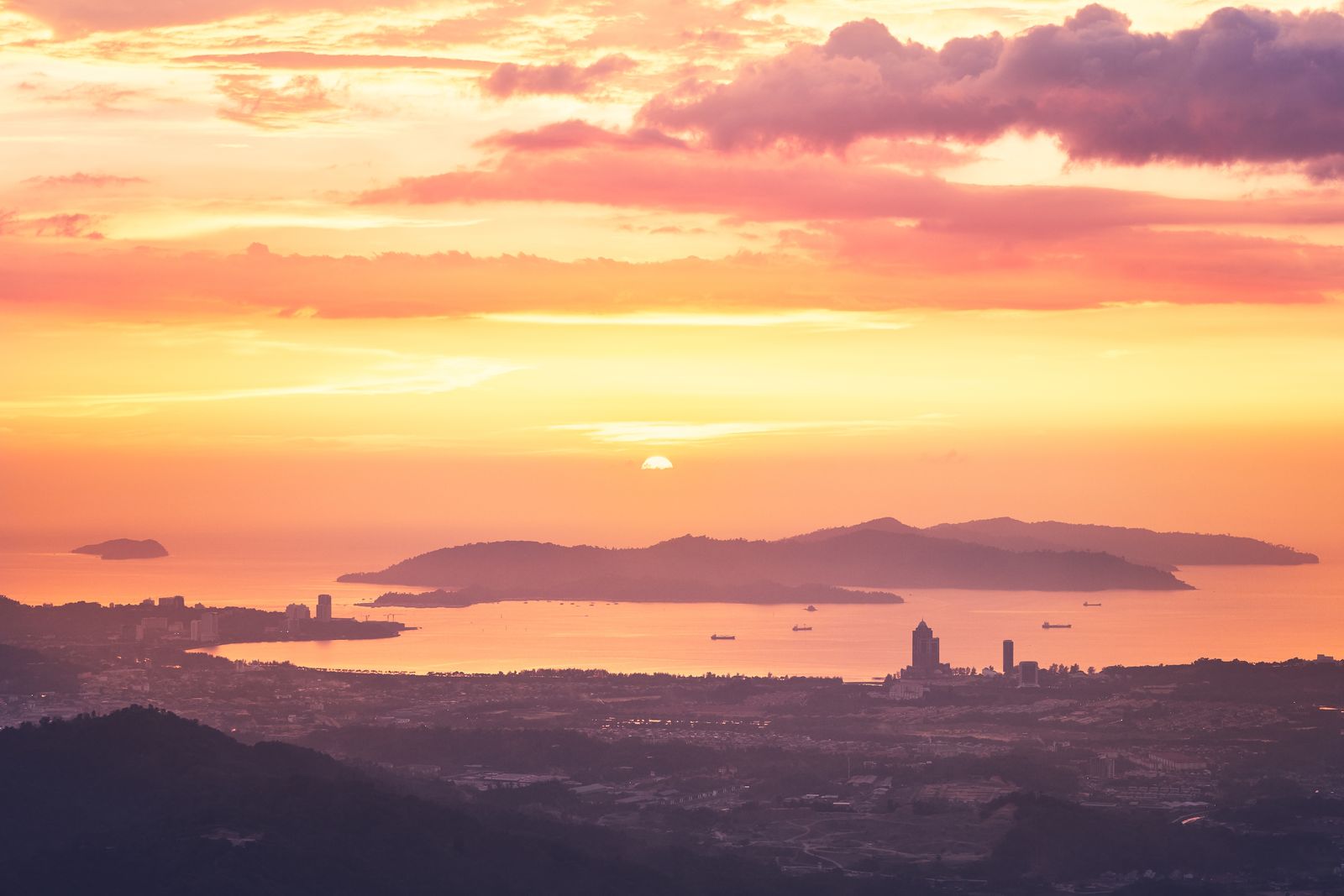 Kota Kinabalu coastline and offshore islands at sunset seen from the hills, home base for Kota Kinabalu JPJ speed limiter fleets