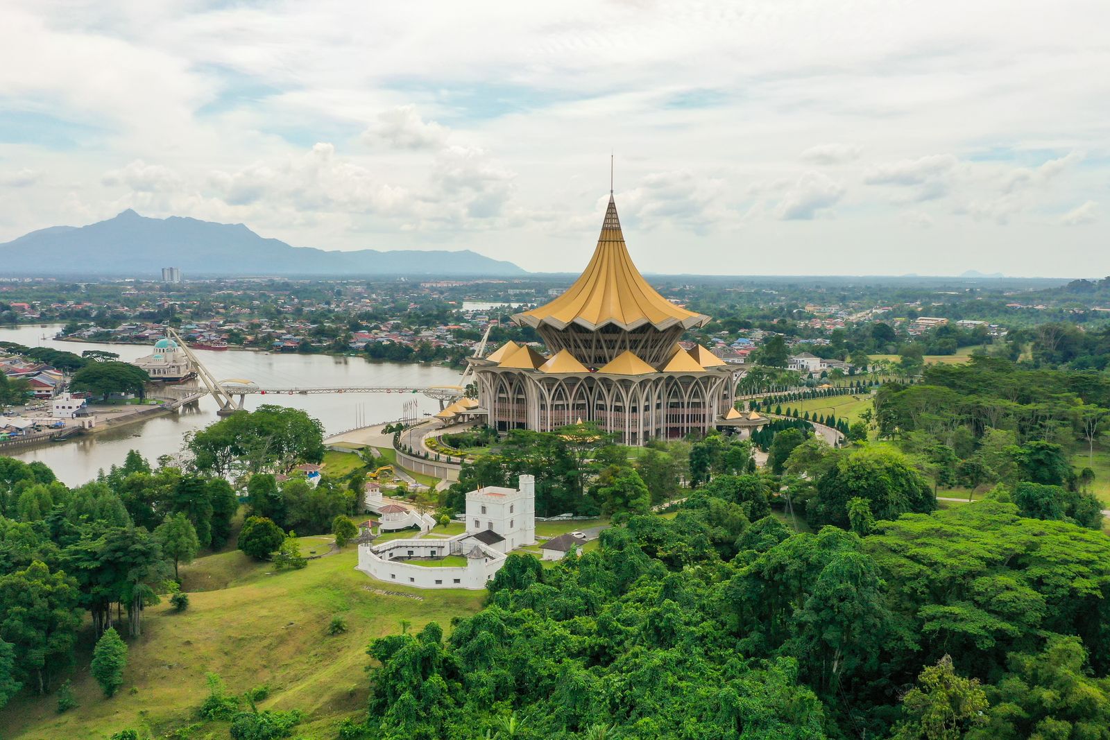 Aerial view of Kuching with the Dewan Undangan Negeri Sarawak building beside the Sarawak River, base for Kuching JPJ speed limiter fleets