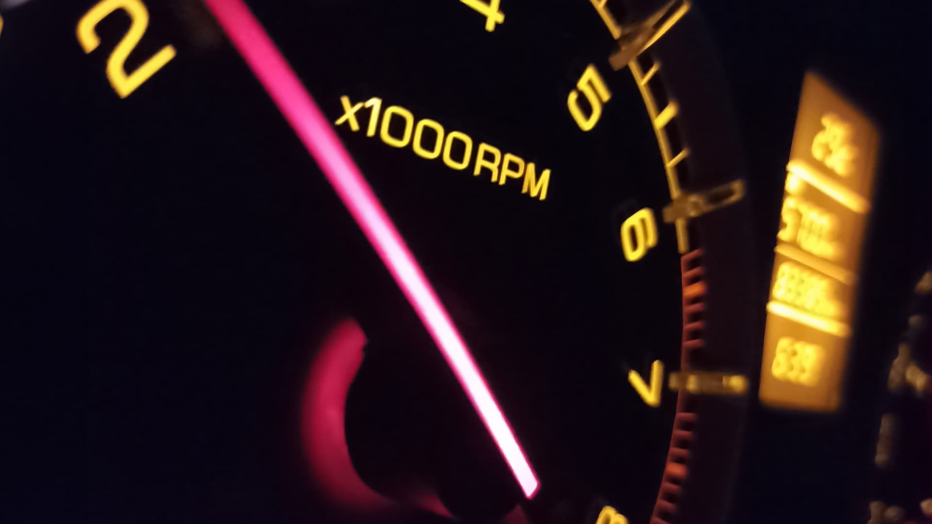 Close-up of a tachometer needle showing engine RPM